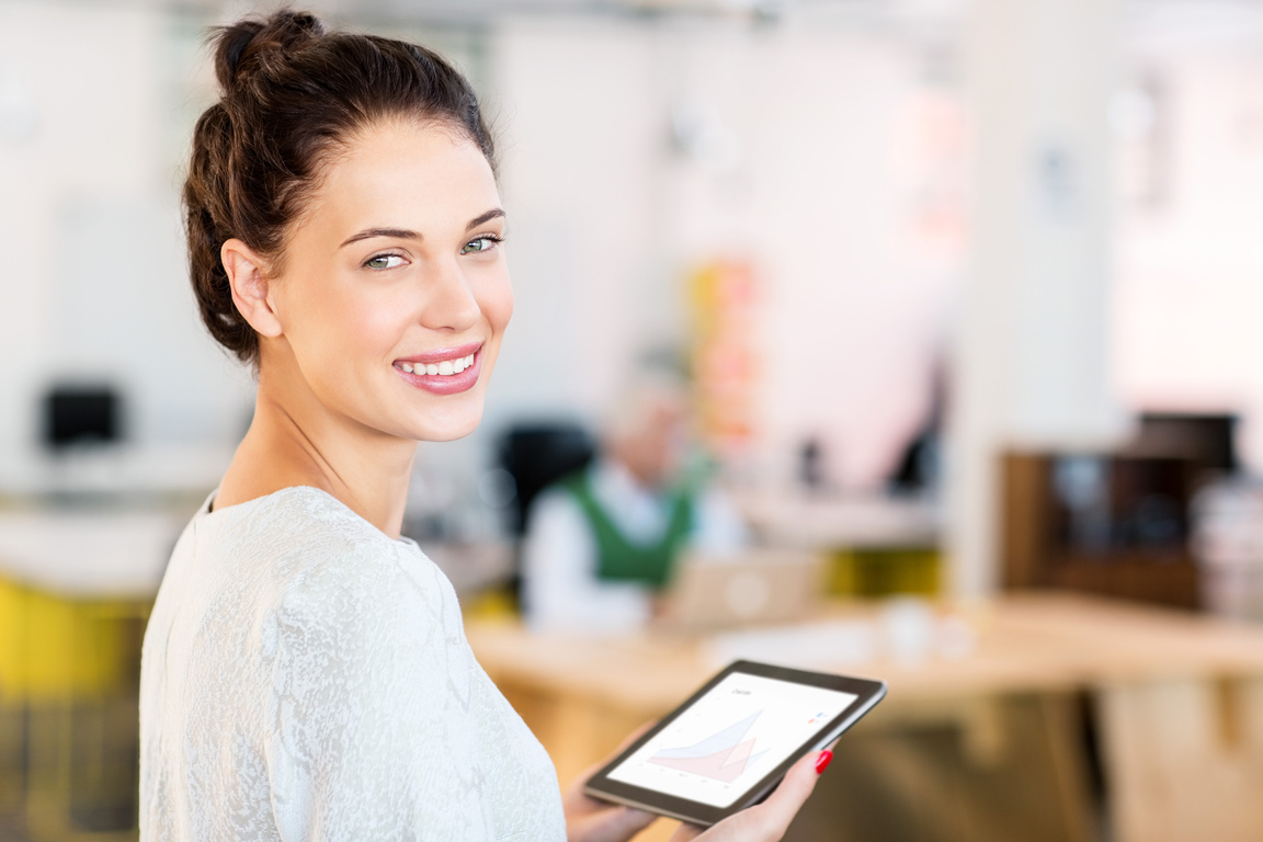 Happy Female Entrepreneur Holding Digital Tablet